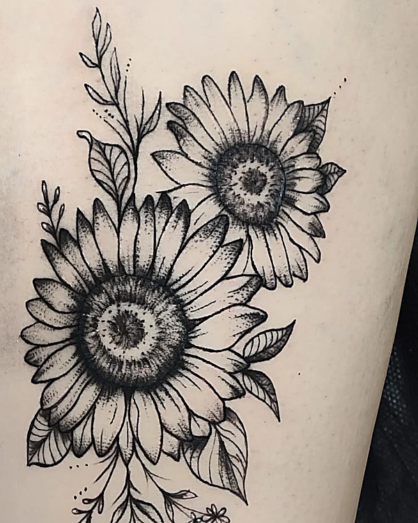 Dos girasoles con hojas en línea negra y sombra, en el brazo
